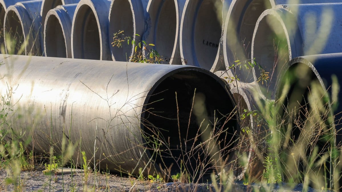 Stacked concrete pipes in outdoor storage area